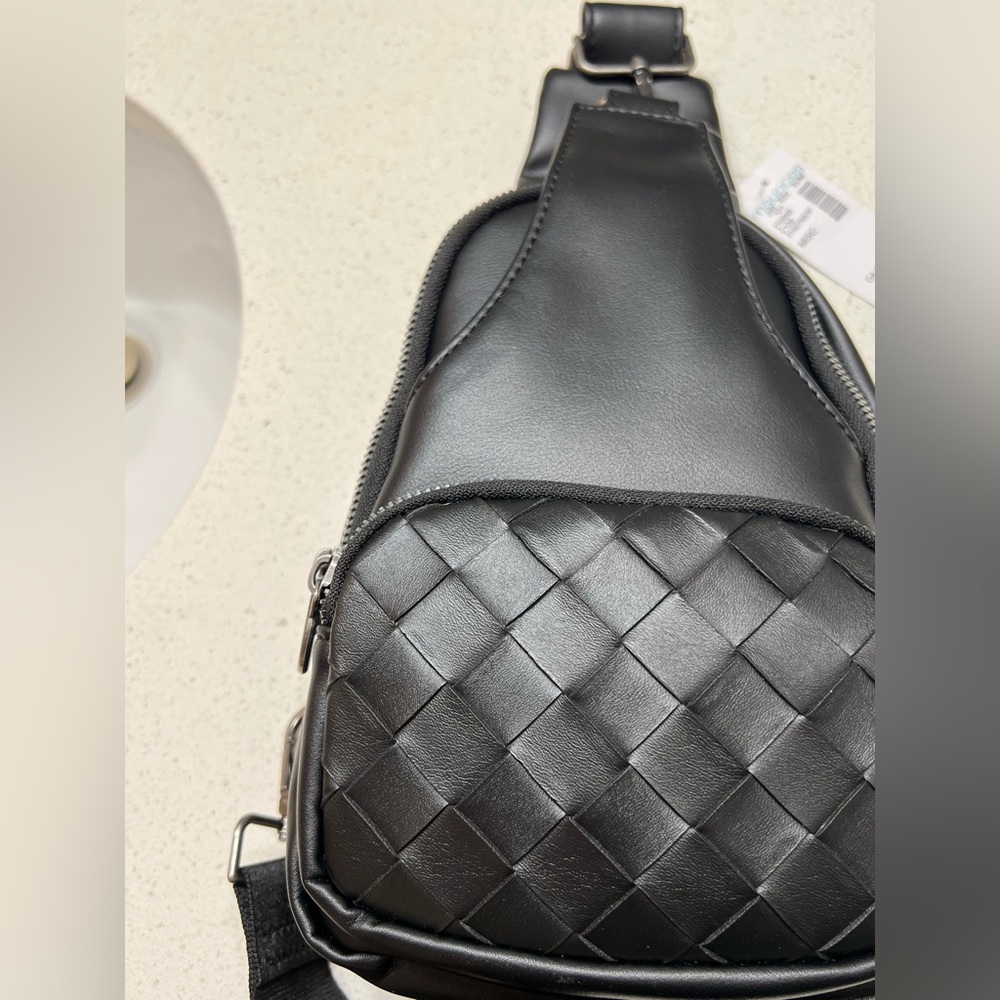 Woven sling bag, black and silver hardware